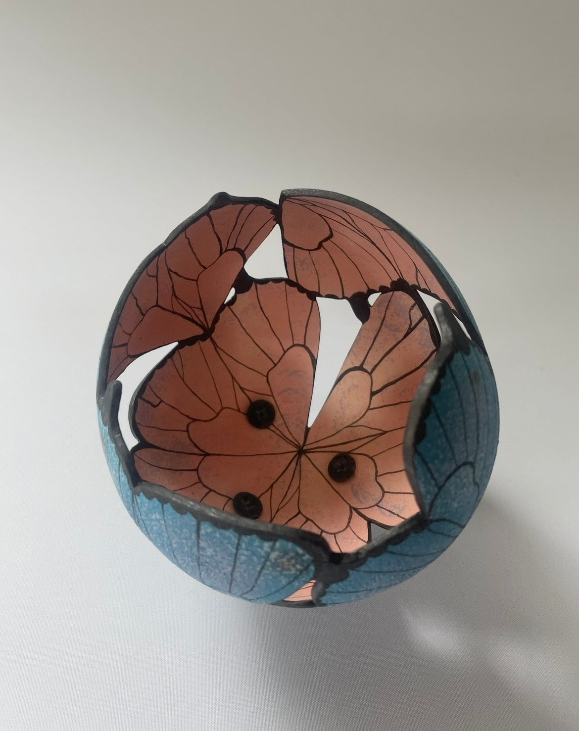 Ceramic butterfly sculpture.