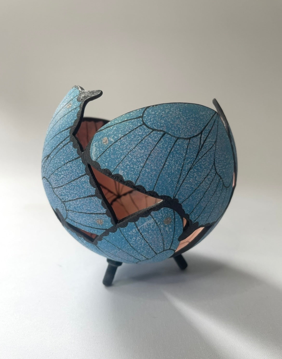 Ceramic butterfly sculpture.
