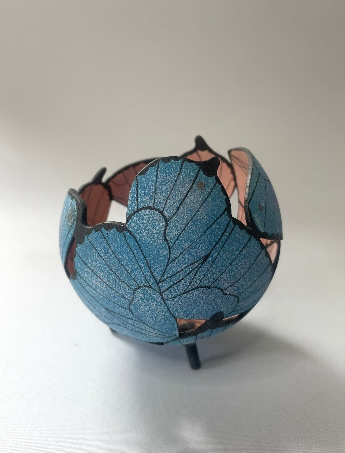 Ceramic butterfly sculpture.