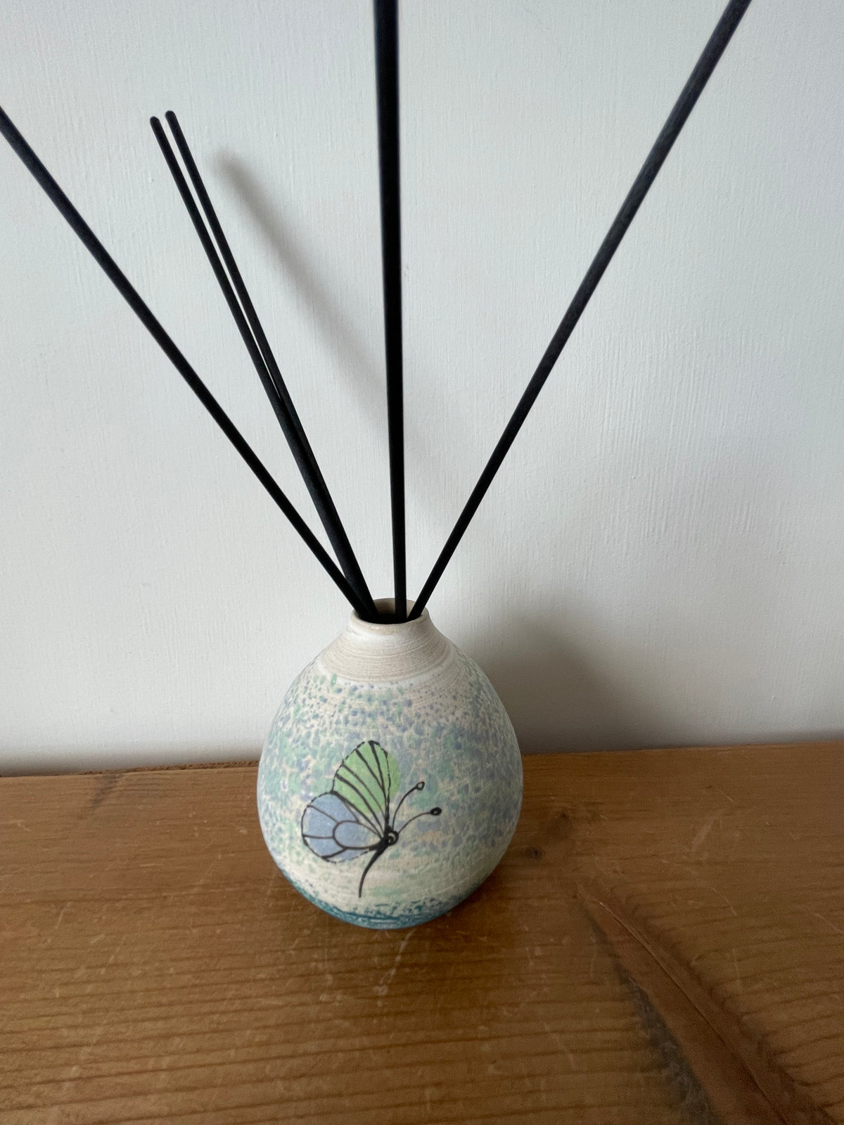 Ceramic butterfly diffuser.