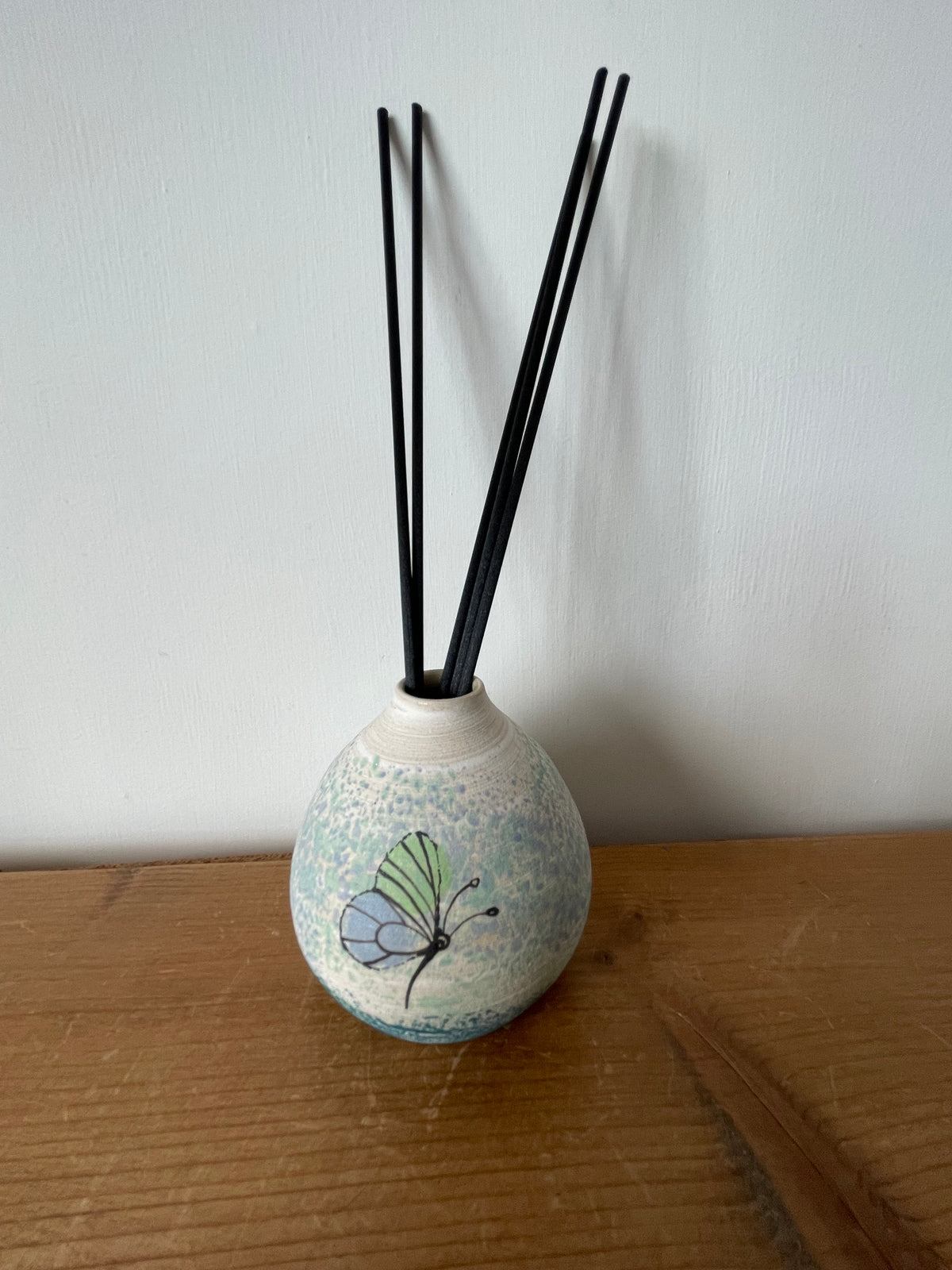 Ceramic butterfly diffuser.